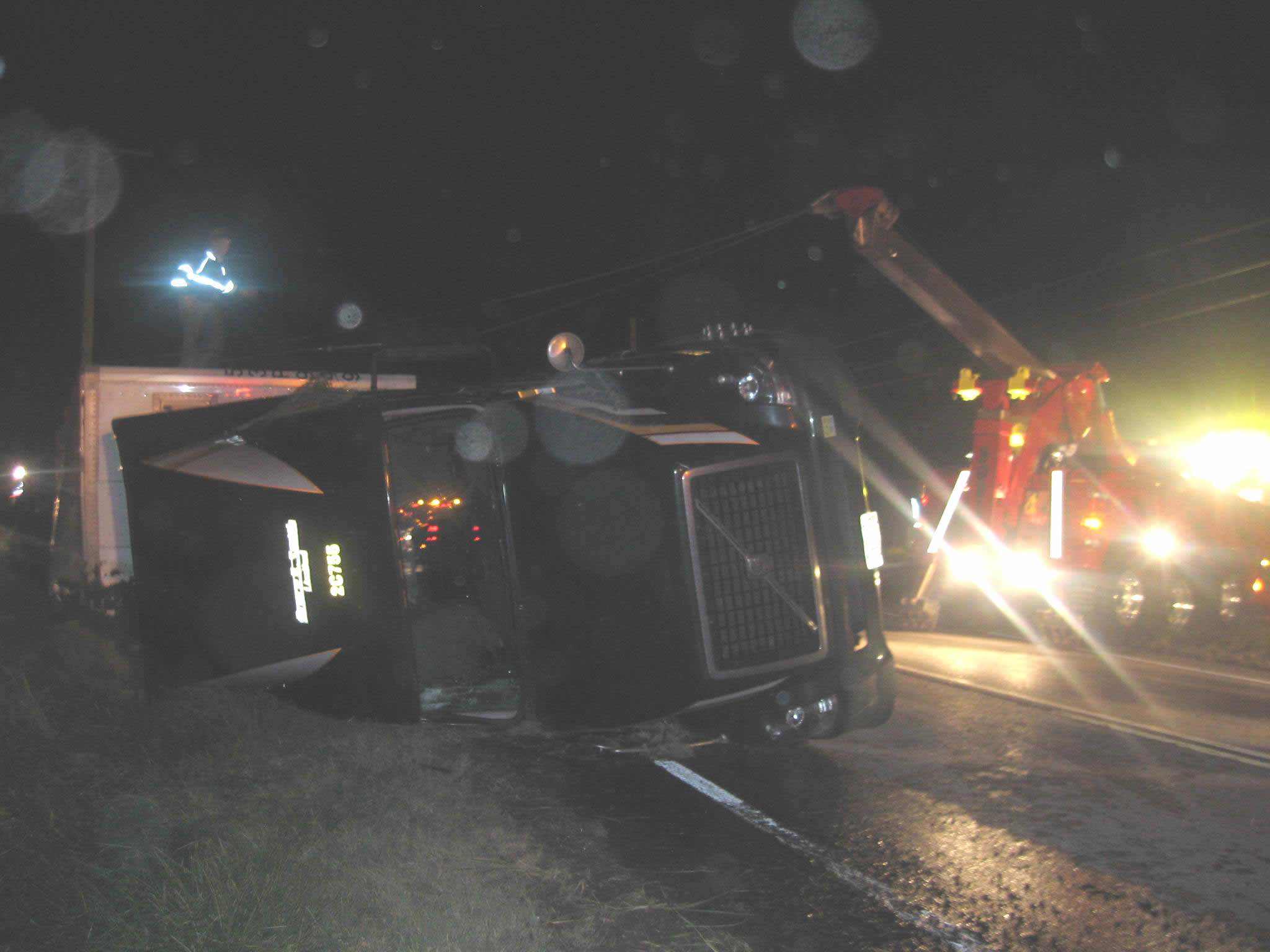 Overturned with 40,000 lbs of rubber matting